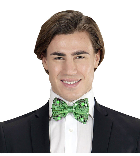 Grøn sløjfe med pailletter og lys