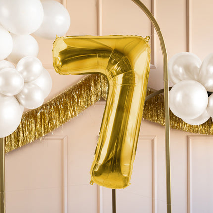 7 års figurballon guld tom 72 cm