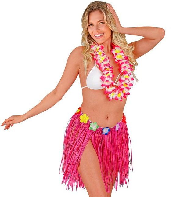 Hawaiirokje Roze Met Bloemenriem 40cm van Widmann koop je bij Partywinkel