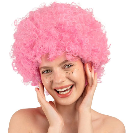 Roze Pruik Afro van Partydeco koop je bij Partywinkel
